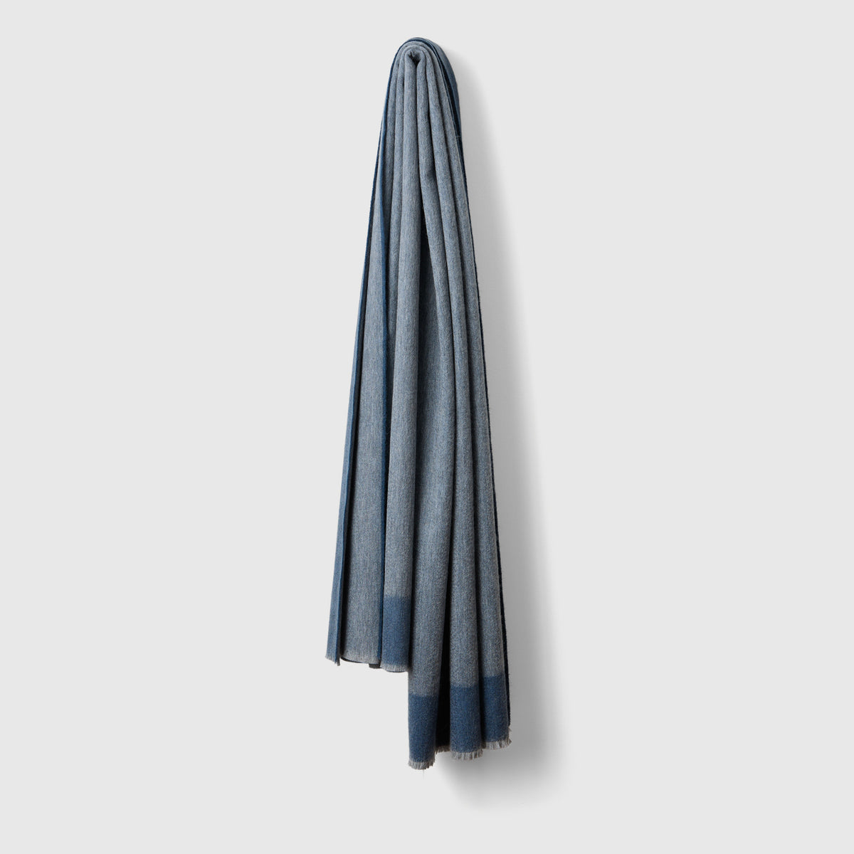 Anmore Cashmere Throw Blanket in Slate hanging up