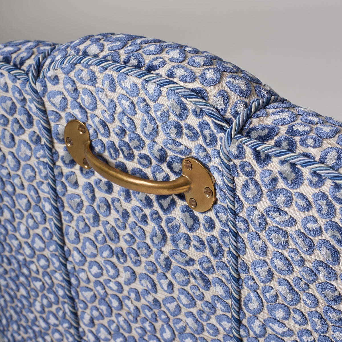 Close up view of the brass handle on the back of the Abbas Carver - Lusia Indigo chair