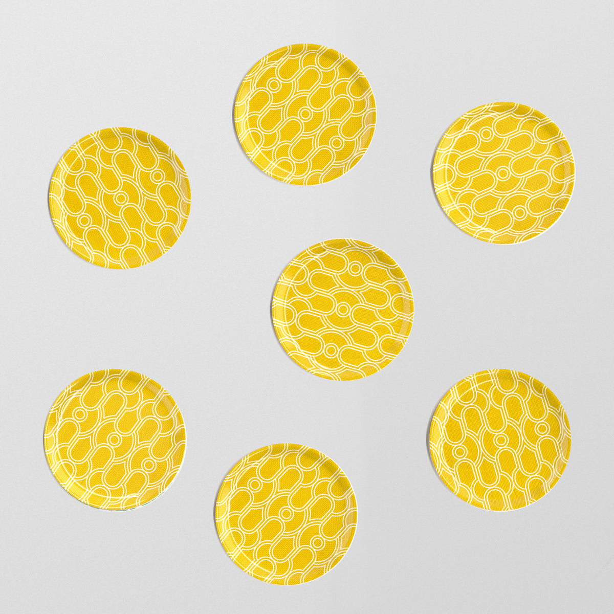 Set of seven yellow chiselled coasters