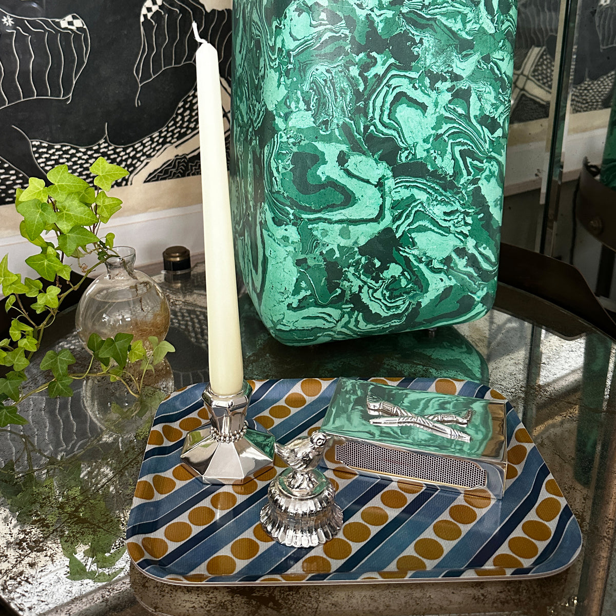 Single silver candle holder with taper with a silver match box